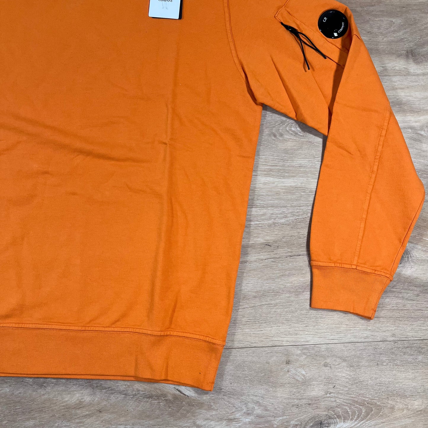 CP Company Light Fleece Crewneck Lens Sweatshirt in Russet Orange